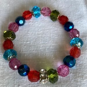 Multicolor glass bead stretch bracelet.  Sz. Lg w/2 1/2-3” opening diameter. $14